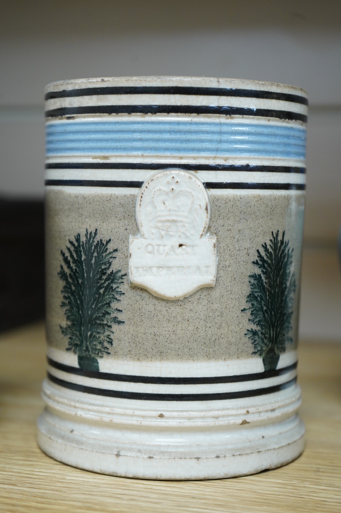 Two early 19th century Mocha ware jugs and two mugs, largest 16cm high